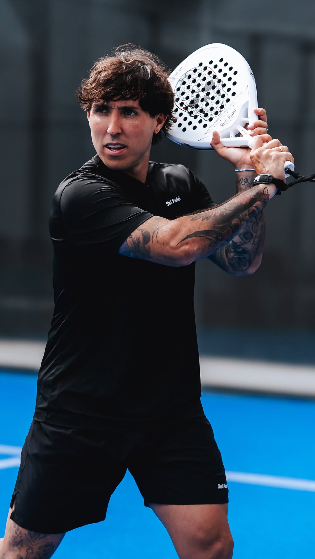 Exequiel Mouriño training on a padel court in Madrid